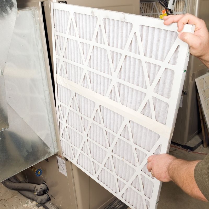 Certified-technician-installing-HEPA-filter-system-