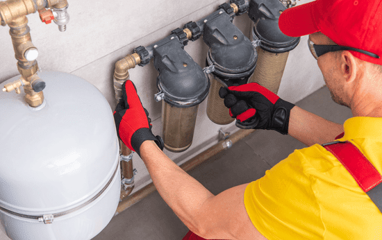 Certified-technician-installing-water-carbon-filter-in-Caledonia-ON-home-LG-Home-Comfort